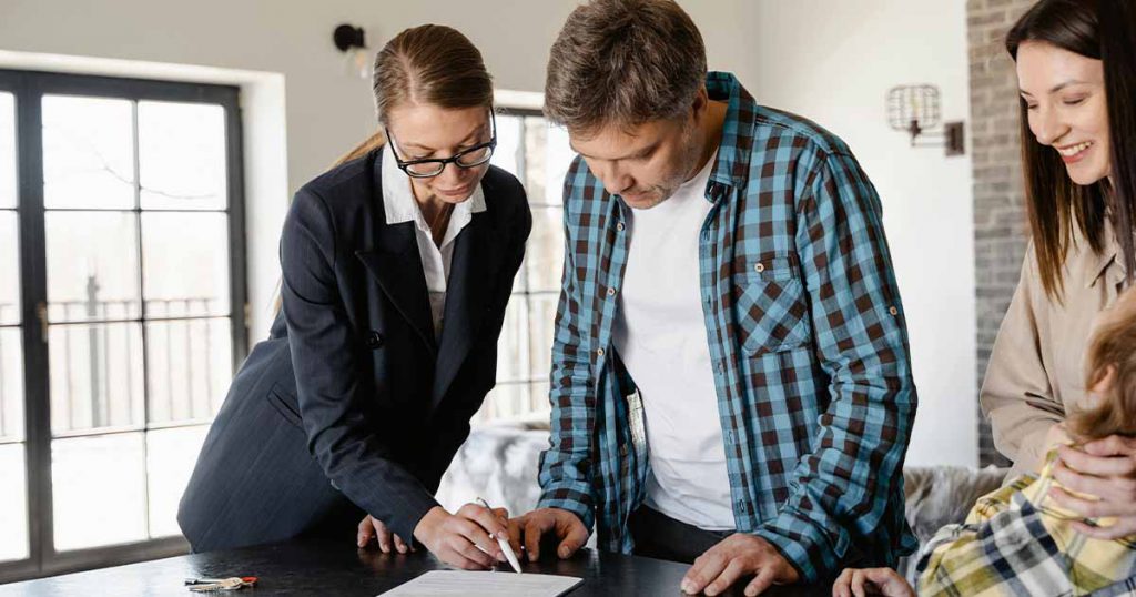 man signing a mortgage