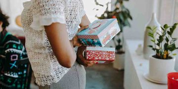 Person holding gifts behind back