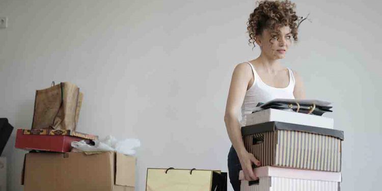 Woman carrying boxes