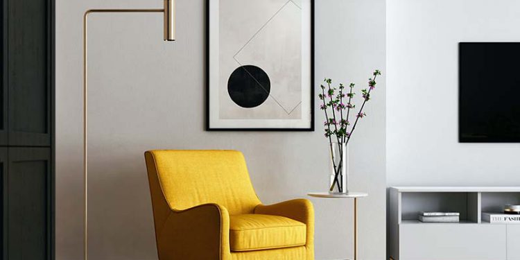 Designed space with yellow chair and black and white wall art