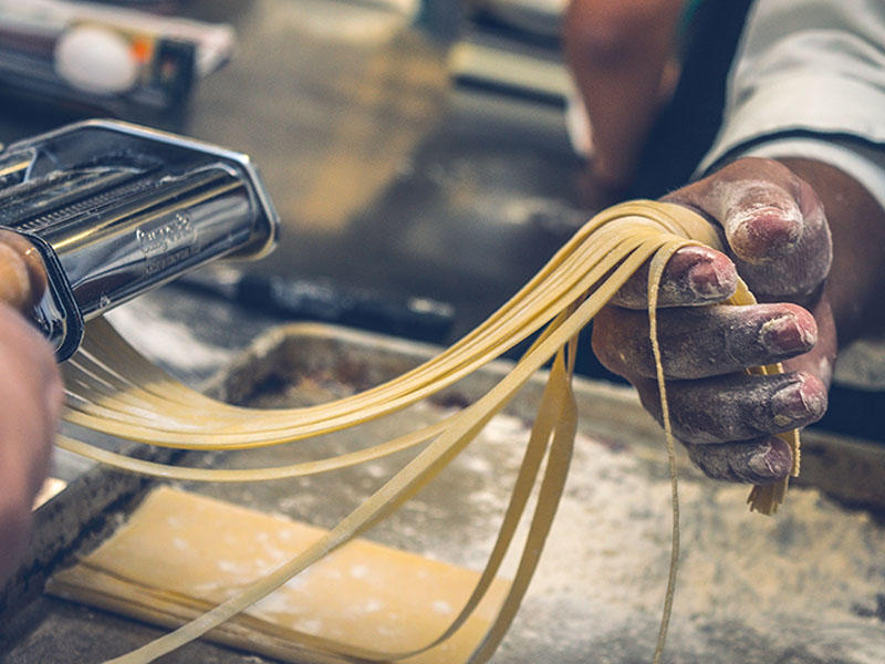 People making homemade pasta.