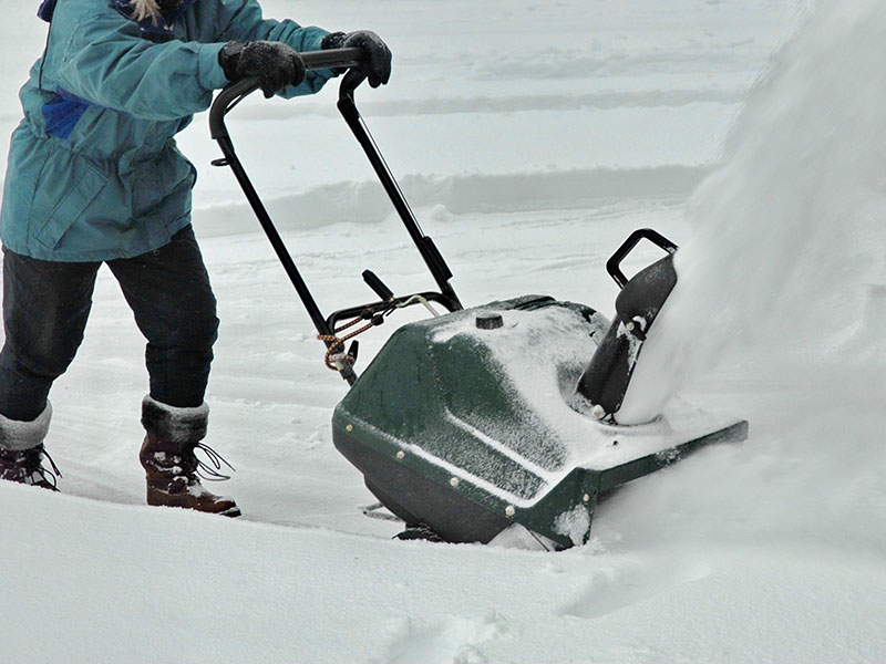 Snow removal with a snowblower.