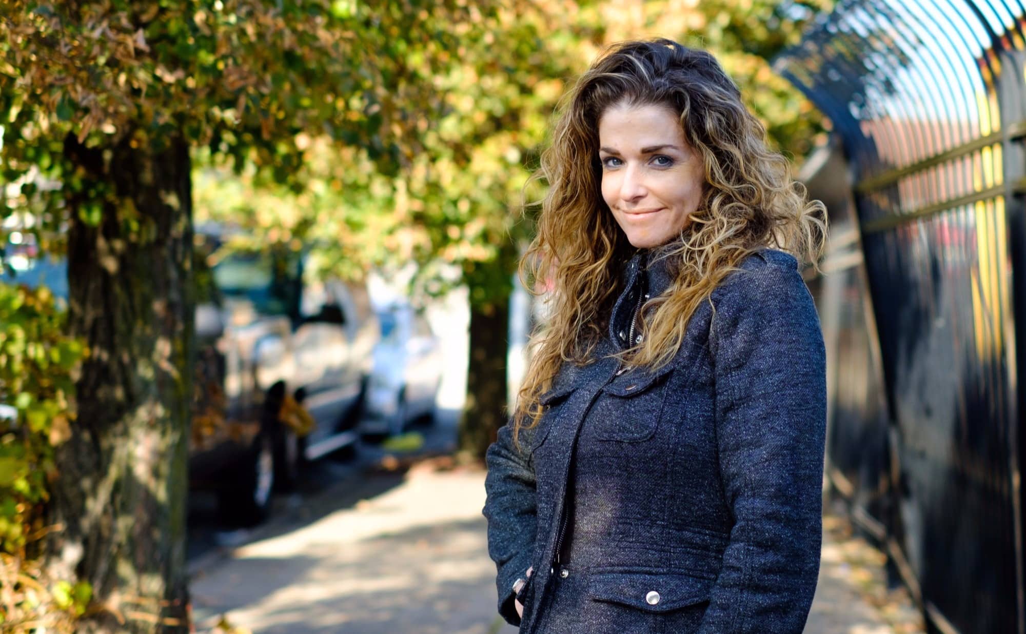 Jennifer Grabel in front of a black fence