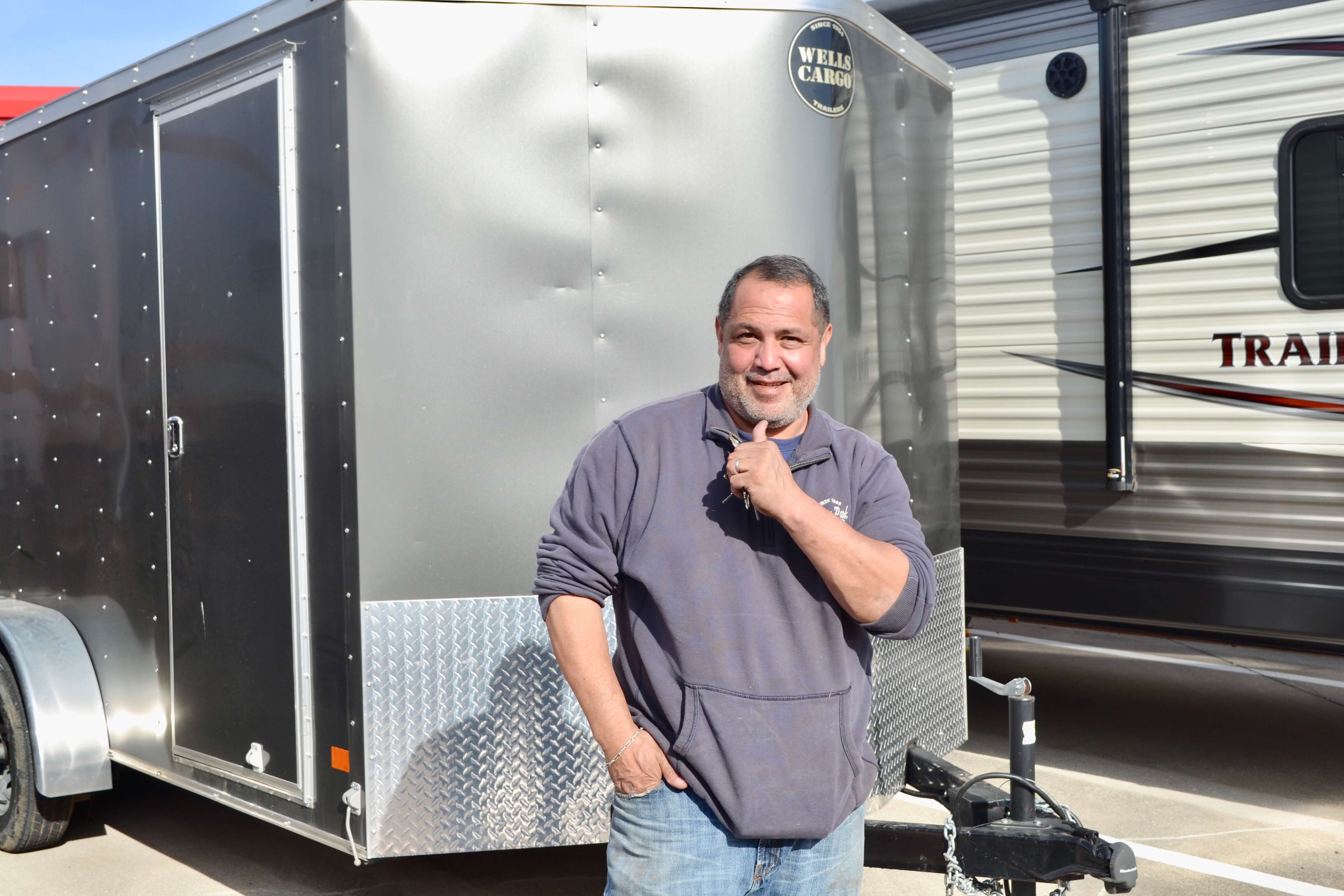 Desi Maes standing in front of his trailer at CubeSmart