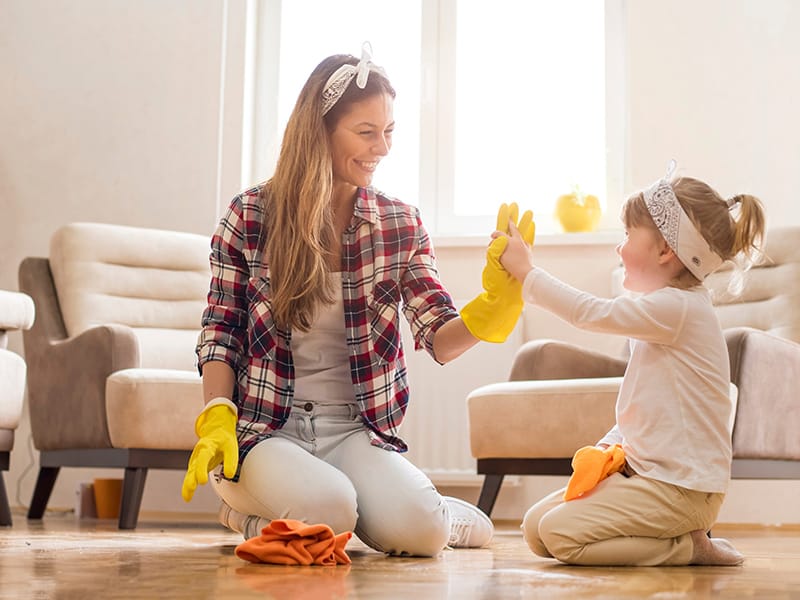 mom and daughter cleaning floor