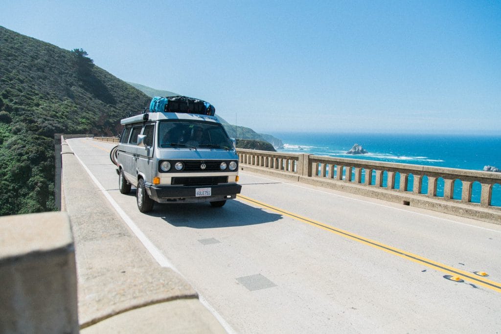 Camper van driving on seaside highway