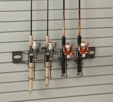 Several fishing rods mounted on a wall rack
