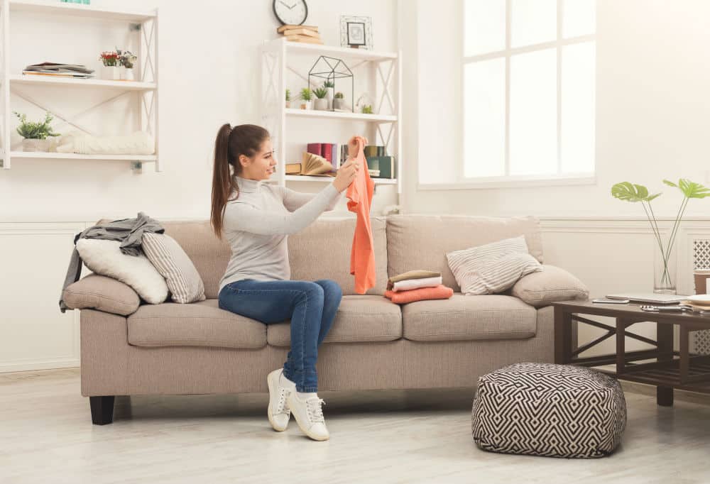 woman looking at orange t-shirt