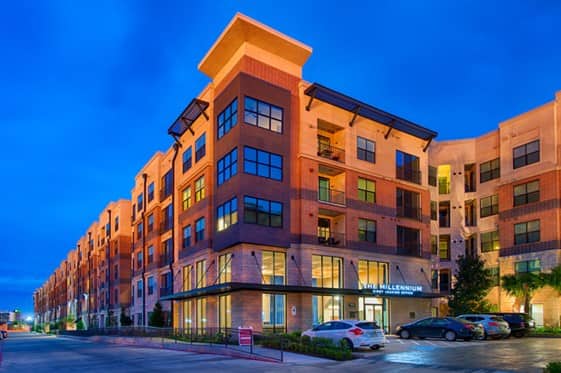 exterior shot at night of The Millennium Kirby apartments in Houston